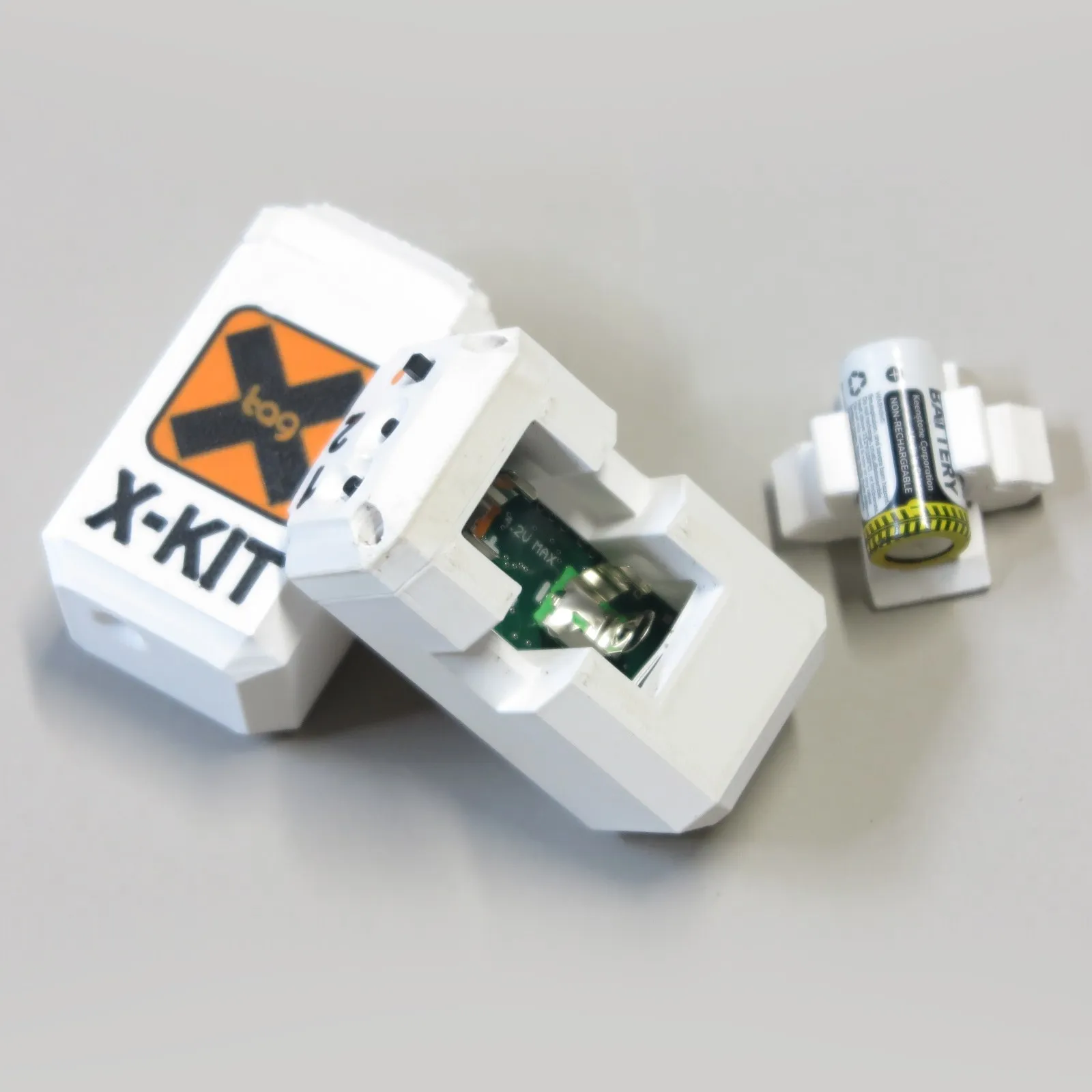 Dispositivo X-Kit X-Tag con emblema arancione — foto 3/3
