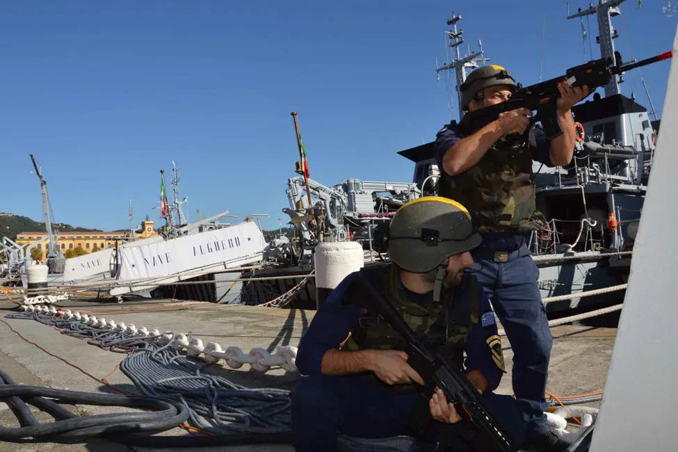 Italian Navy personnel training with X-Tag replicas on the dock during the Dynamic Move exercise